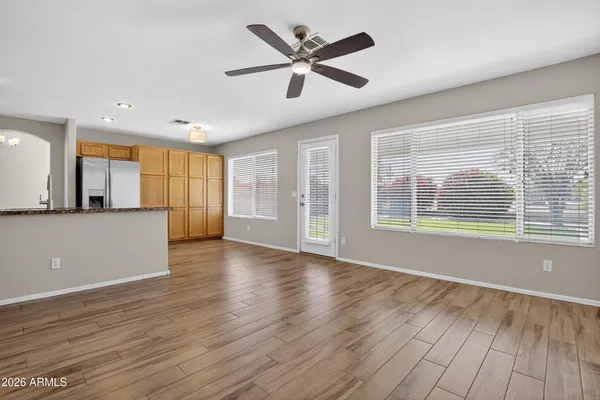 a kitchen with granite countertop a sink cabinets and stainless steel appliances