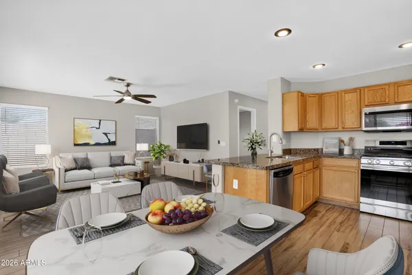 a bedroom with a large bed and a potted plant