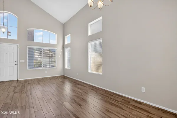 a view of a dining room with furniture and a kitchen
