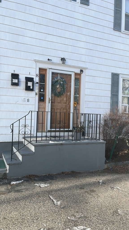 6 South Street, Unit 2 Haverhill, MA 01832 - Photo 1 of 1 a view of a patio with chairs and potted plants