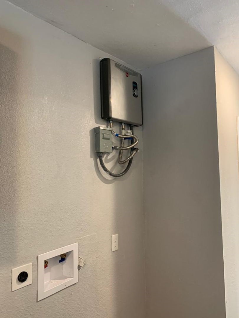 211 East Sterling Avenue, Unit 4 Baytown, TX 77520 - Photo 6 of 7 a room with a mirror and a wooden floor