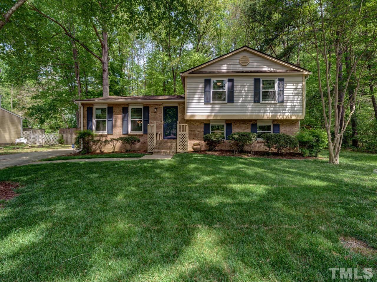 7249 Mine Shaft Road Raleigh, NC 27615 - Photo 1 of 45 a front view of a house with a yard and trees