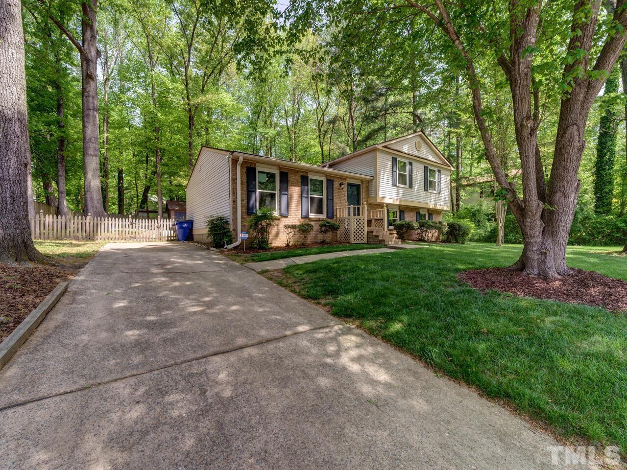7249 Mine Shaft Road Raleigh, NC 27615 - Photo 2 of 45 a front view of a house with a yard and trees