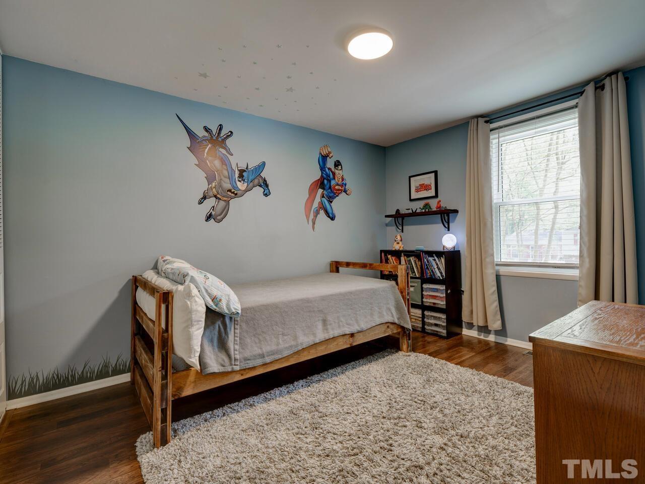 7249 Mine Shaft Road Raleigh, NC 27615 - Photo 22 of 45 a bedroom with a bed and a window