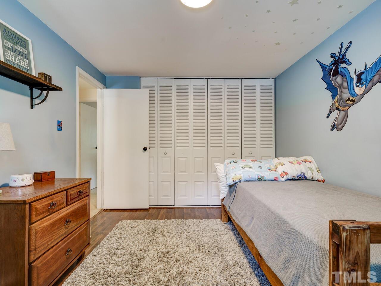7249 Mine Shaft Road Raleigh, NC 27615 - Photo 23 of 45 a bedroom with a bed and a window