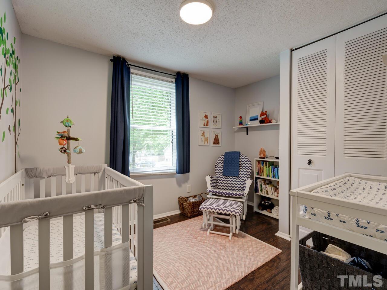 7249 Mine Shaft Road Raleigh, NC 27615 - Photo 24 of 45 a bedroom with furniture and a window