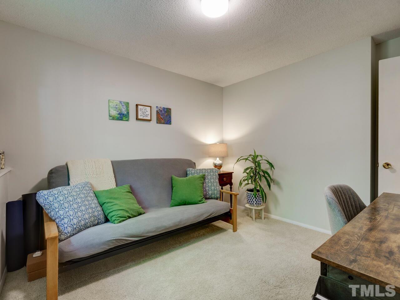 7249 Mine Shaft Road Raleigh, NC 27615 - Photo 26 of 45 a living room with furniture and a couch