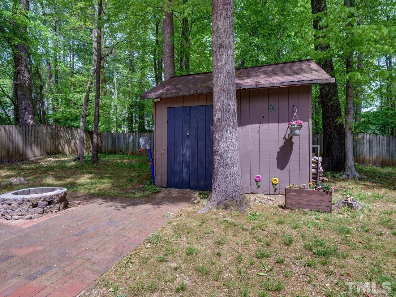 7249 Mine Shaft Road Raleigh, NC 27615 - Photo 32 of 45 a front view of a house with garden