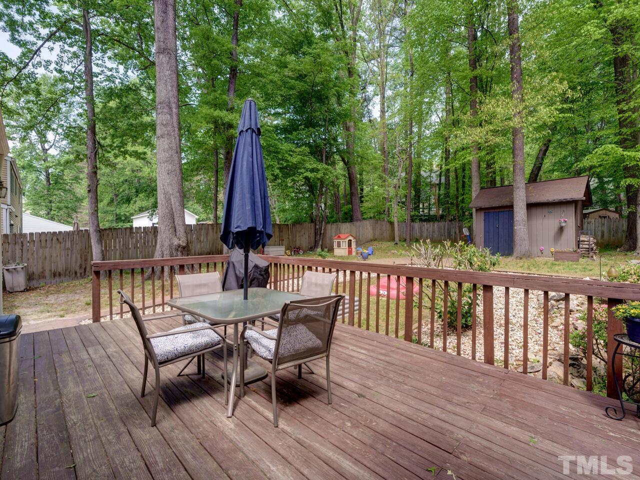 7249 Mine Shaft Road Raleigh, NC 27615 - Photo 34 of 45 a view of a two chairs and table on the wooden floor