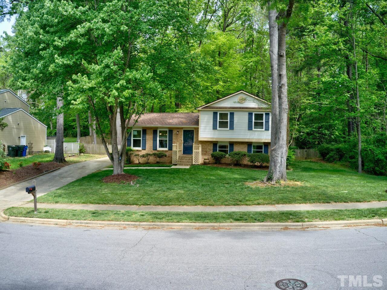 7249 Mine Shaft Road Raleigh, NC 27615 - Photo 36 of 45 a front view of a house with a yard