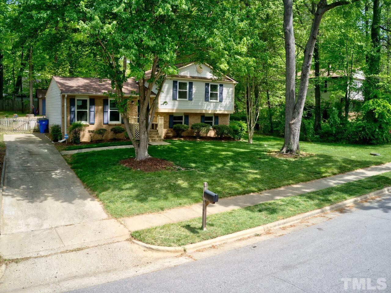 7249 Mine Shaft Road Raleigh, NC 27615 - Photo 39 of 45 a front view of a house with a yard