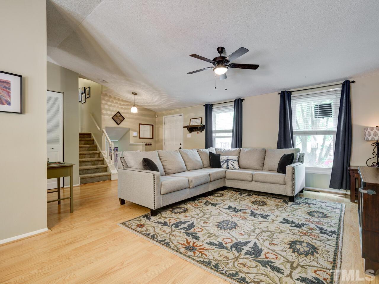 7249 Mine Shaft Road Raleigh, NC 27615 - Photo 5 of 45 a living room with furniture and a ceiling fan
