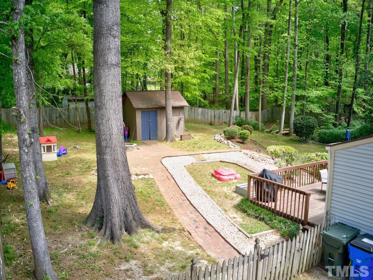 7249 Mine Shaft Road Raleigh, NC 27615 - Photo 42 of 45 a front view of a house with garden