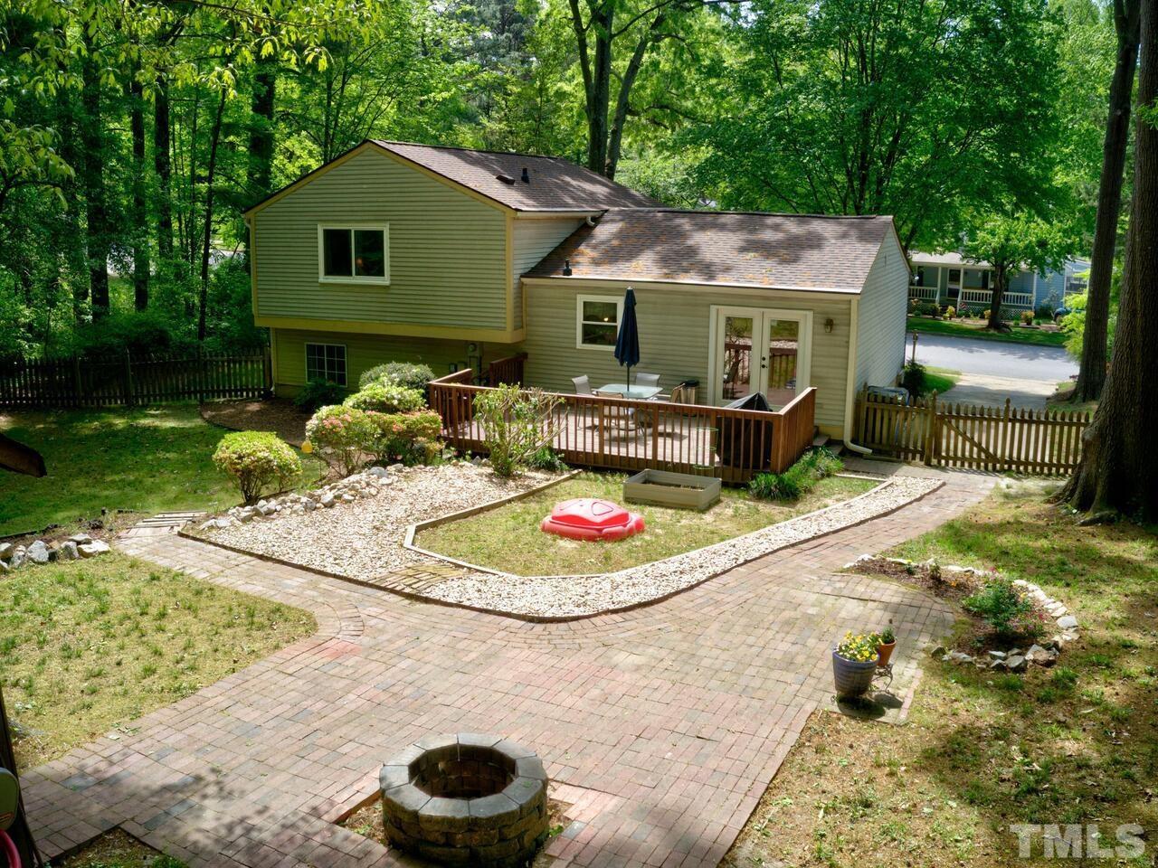 7249 Mine Shaft Road Raleigh, NC 27615 - Photo 43 of 45 a backyard of a house with yard and outdoor seating