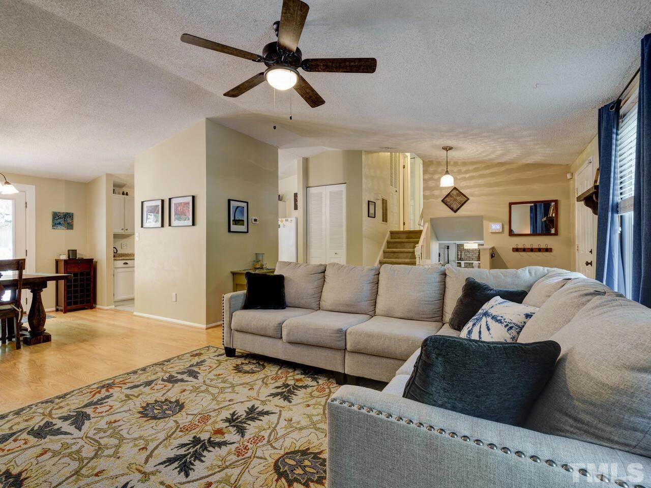 7249 Mine Shaft Road Raleigh, NC 27615 - Photo 6 of 45 a living room with furniture and a rug