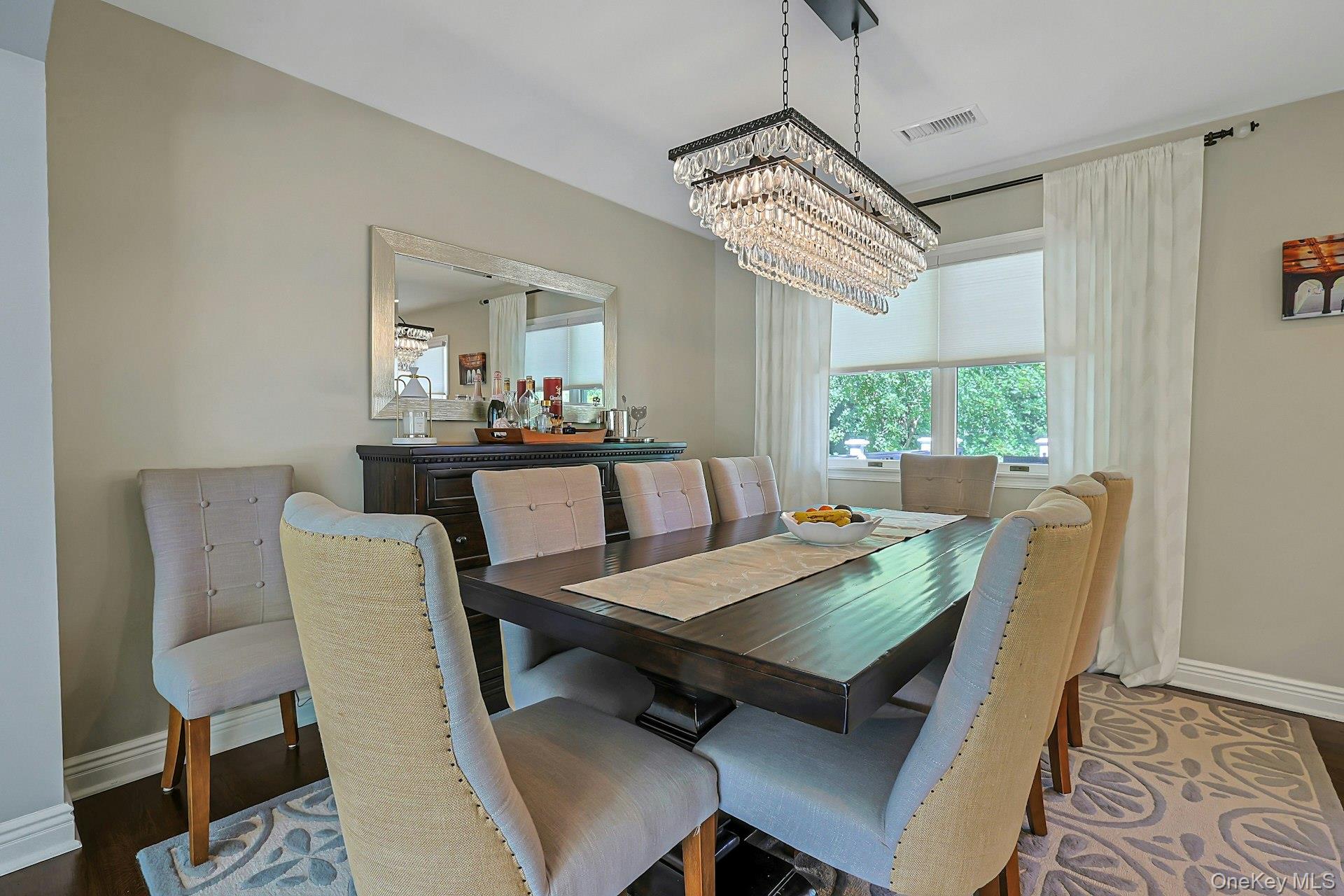 9 Stonegate Road Valhalla, NY 10595 - Photo 16 of 42 Dining area with a tiered crystal chandelier, recessed lighting, and hardwood flooring