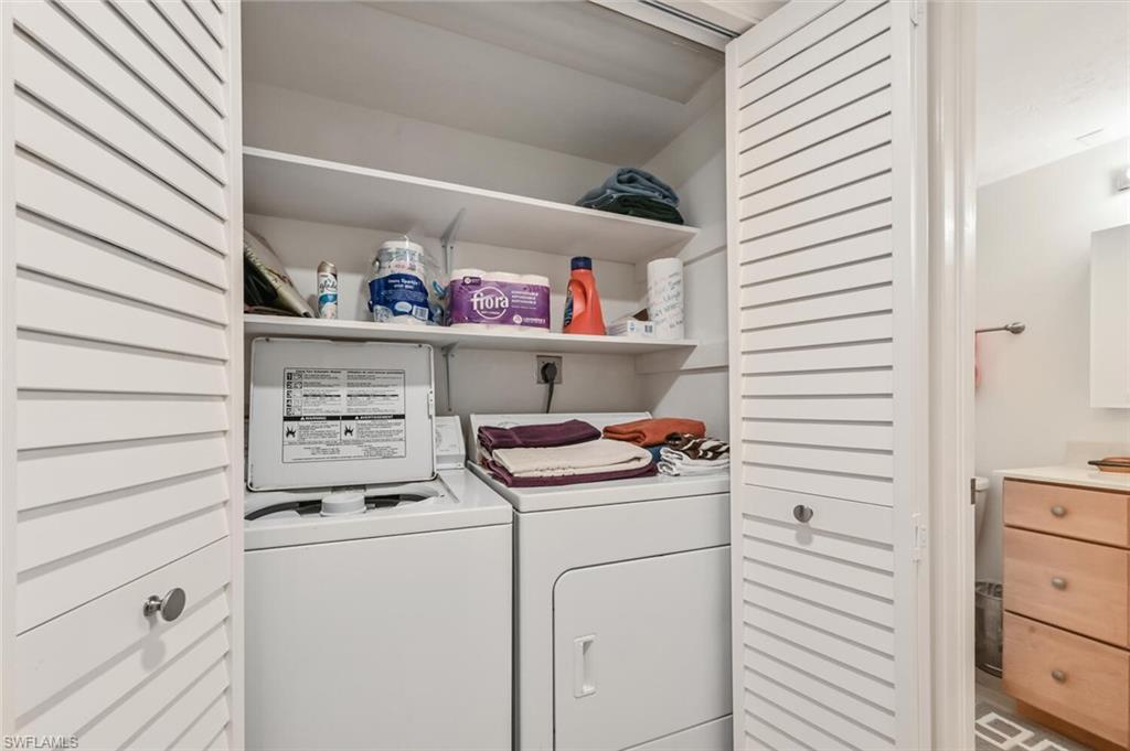 492 Veranda Way, Unit E105 Naples, FL 34104 - Photo 19 of 34 a utility room with dryer and washer