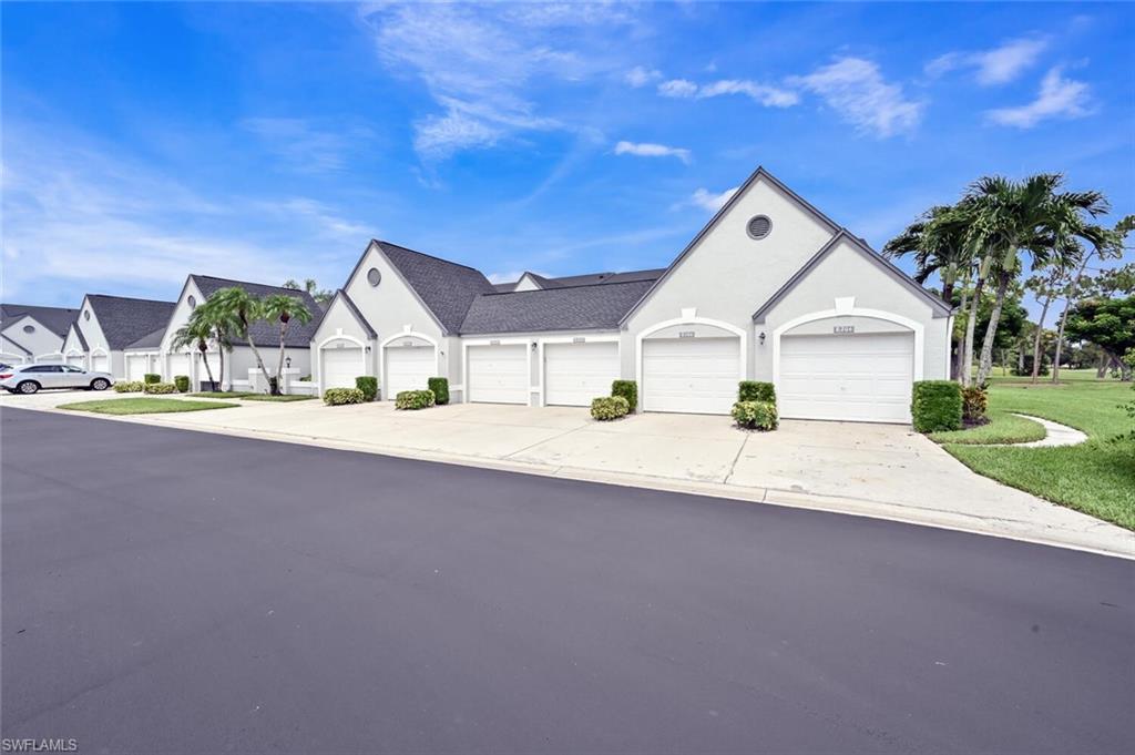 492 Veranda Way, Unit E105 Naples, FL 34104 - Photo 21 of 34 a view of house with outdoor space and street view