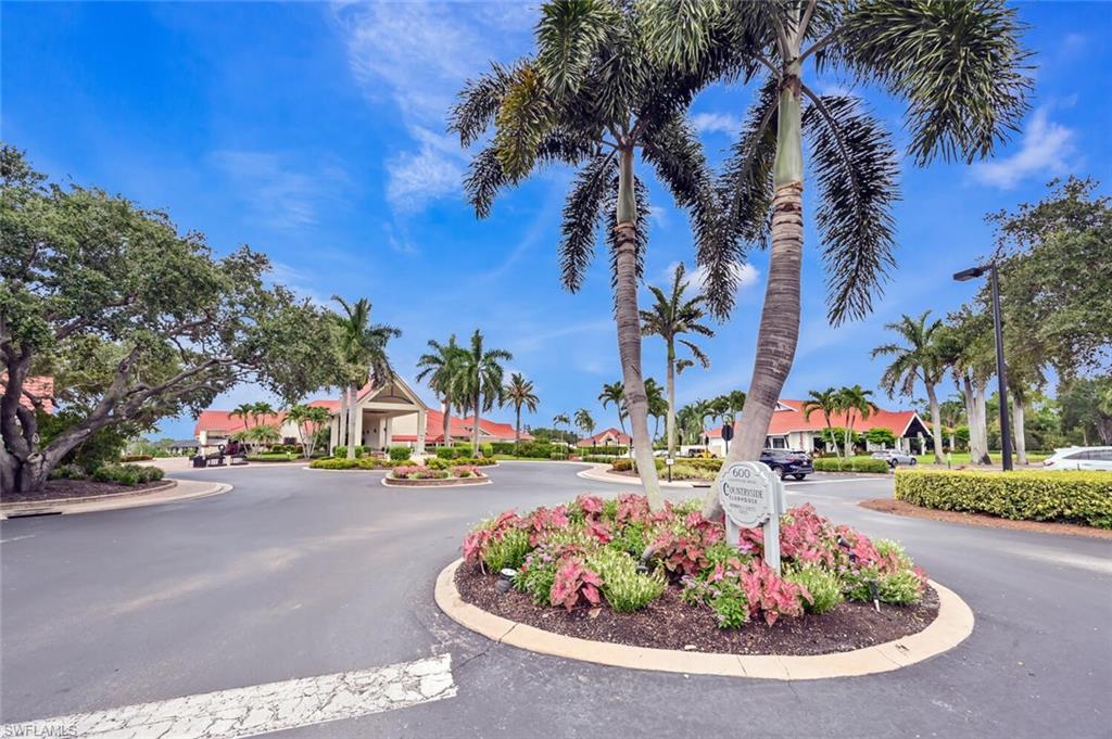 492 Veranda Way, Unit E105 Naples, FL 34104 - Photo 24 of 34 a view of a street with cars