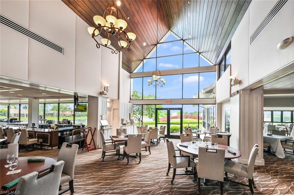 492 Veranda Way, Unit E105 Naples, FL 34104 - Photo 25 of 34 a view of a dining room with furniture window and outside view