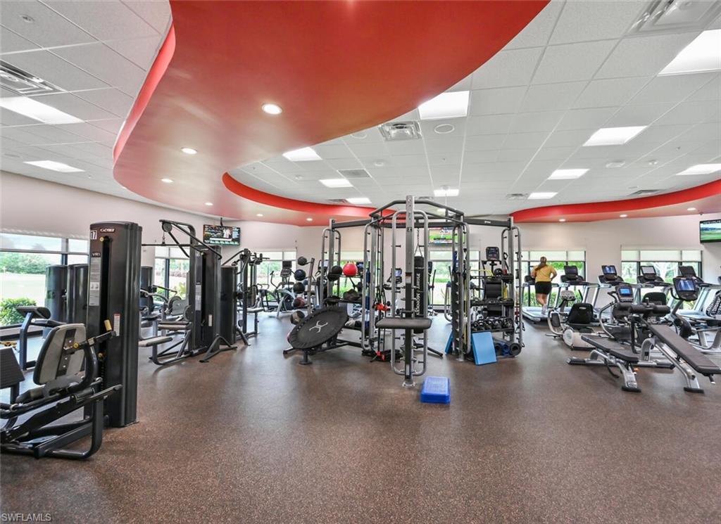 492 Veranda Way, Unit E105 Naples, FL 34104 - Photo 28 of 34 a view of a room with gym equipment