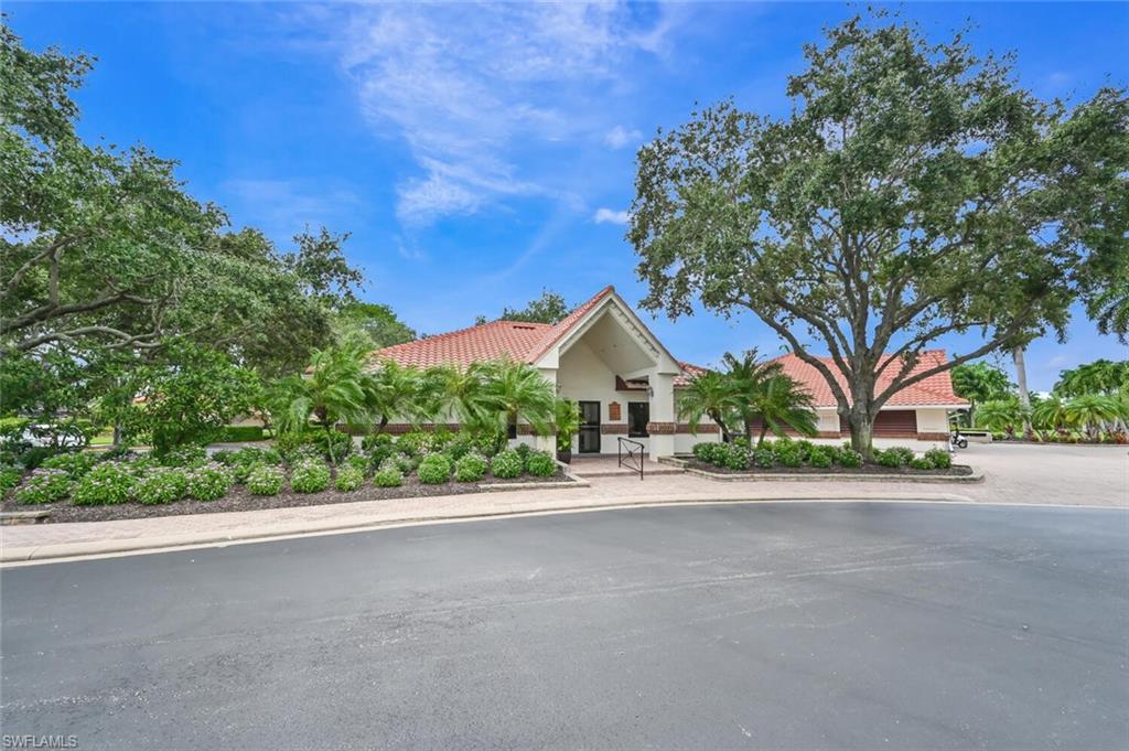492 Veranda Way, Unit E105 Naples, FL 34104 - Photo 33 of 34 front view of a house with a street