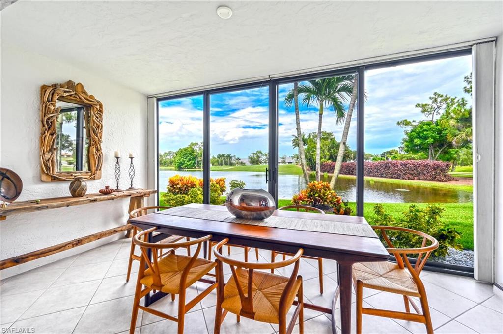 492 Veranda Way, Unit E105 Naples, FL 34104 - Photo 7 of 34 a view of a dining room with furniture window and outside view
