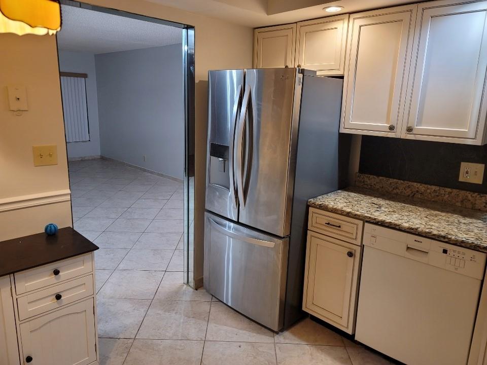 8657 Boca Glades Boulevard Boca Raton, FL 33434 - Photo 2 of 6 a kitchen with appliances and cabinets