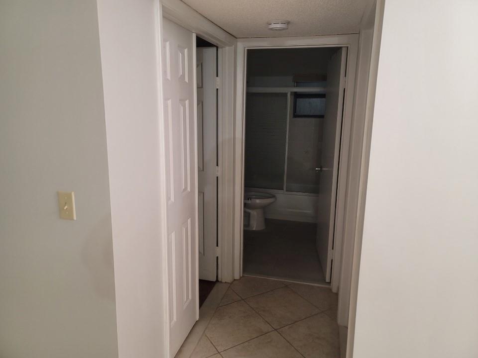 8657 Boca Glades Boulevard Boca Raton, FL 33434 - Photo 4 of 6 a view of a hallway