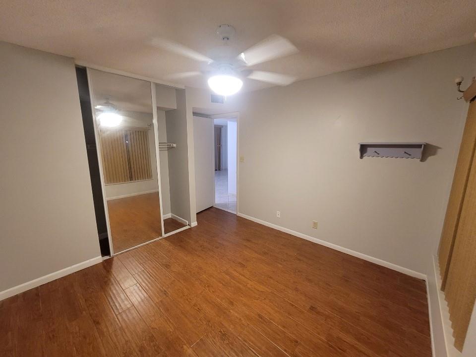 8657 Boca Glades Boulevard Boca Raton, FL 33434 - Photo 5 of 6 a view of empty room with wooden floor