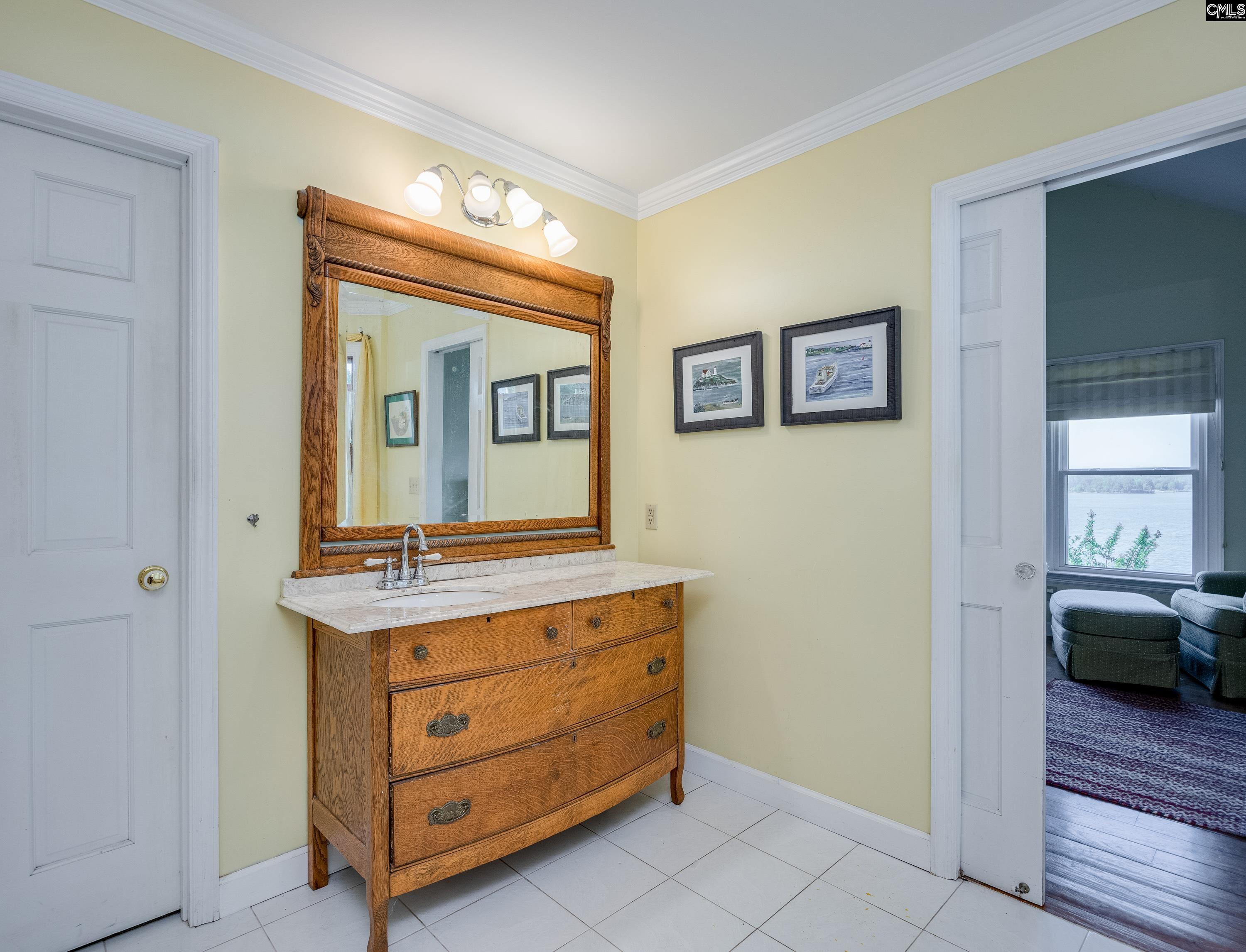 2577 Harbor View Road Camden, SC 29020 - Photo 26 of 42 a room that has a chair and dresser in it