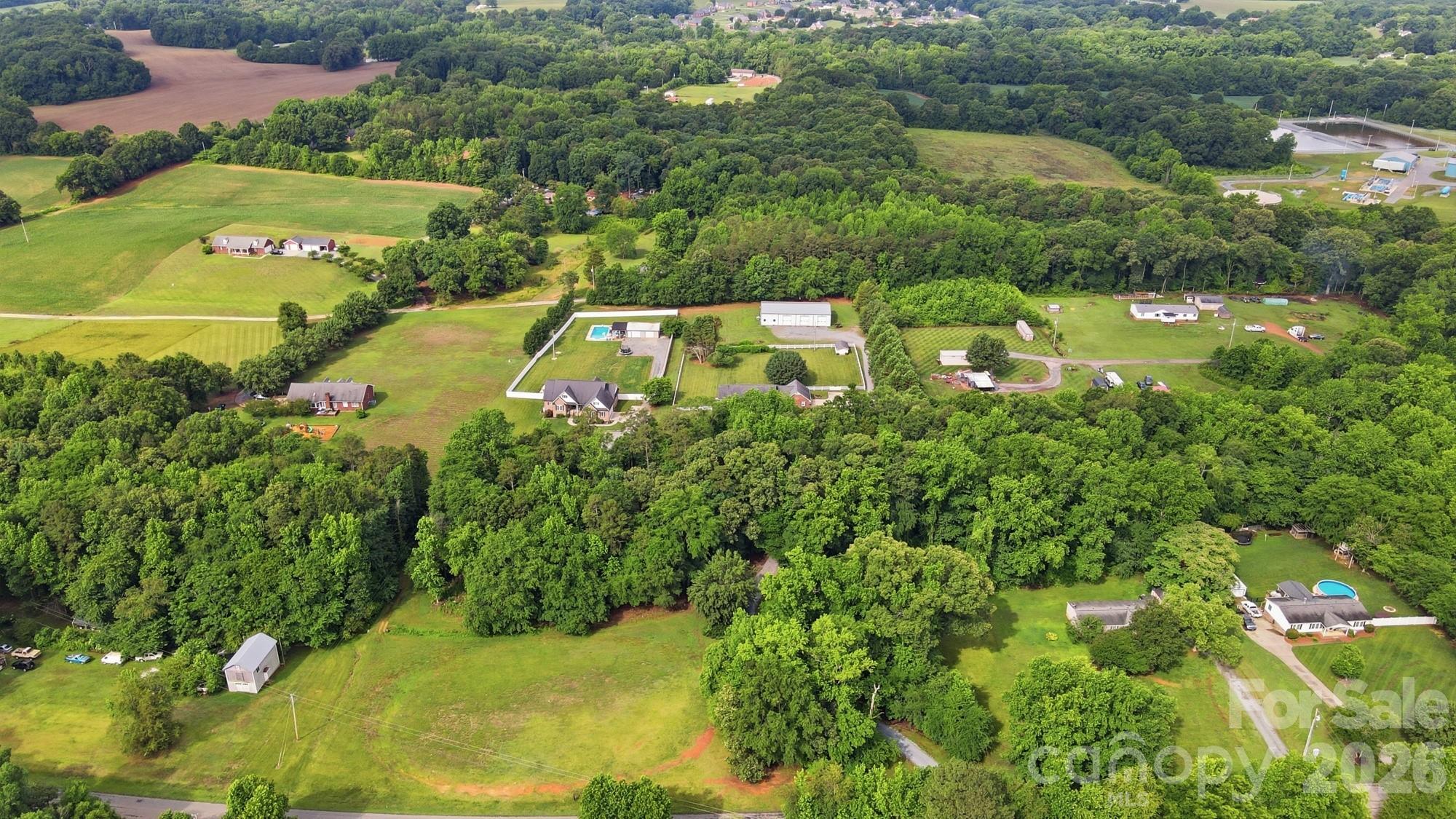 4017 Mullis Newsome Road Monroe, NC 28110 - Photo 2 of 38 an aerial view of residential houses with outdoor space and street view