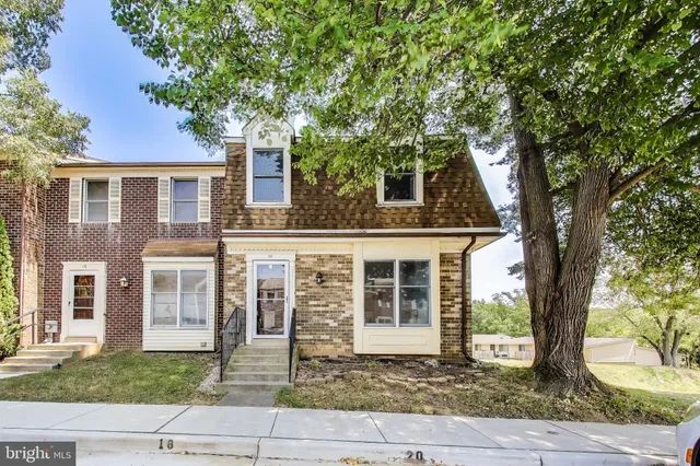 front view of house with a tree