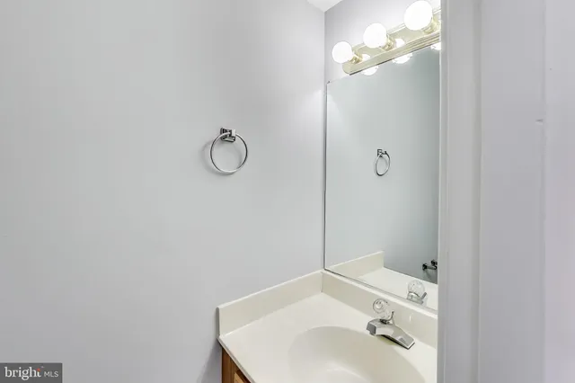 a bathroom with a sink and vanity