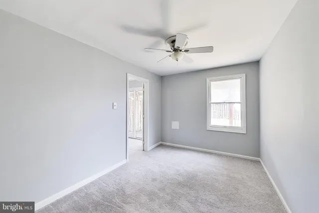 a view of empty room with windows
