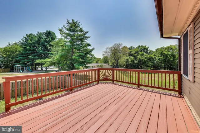 a view of deck with wooden floor and fence