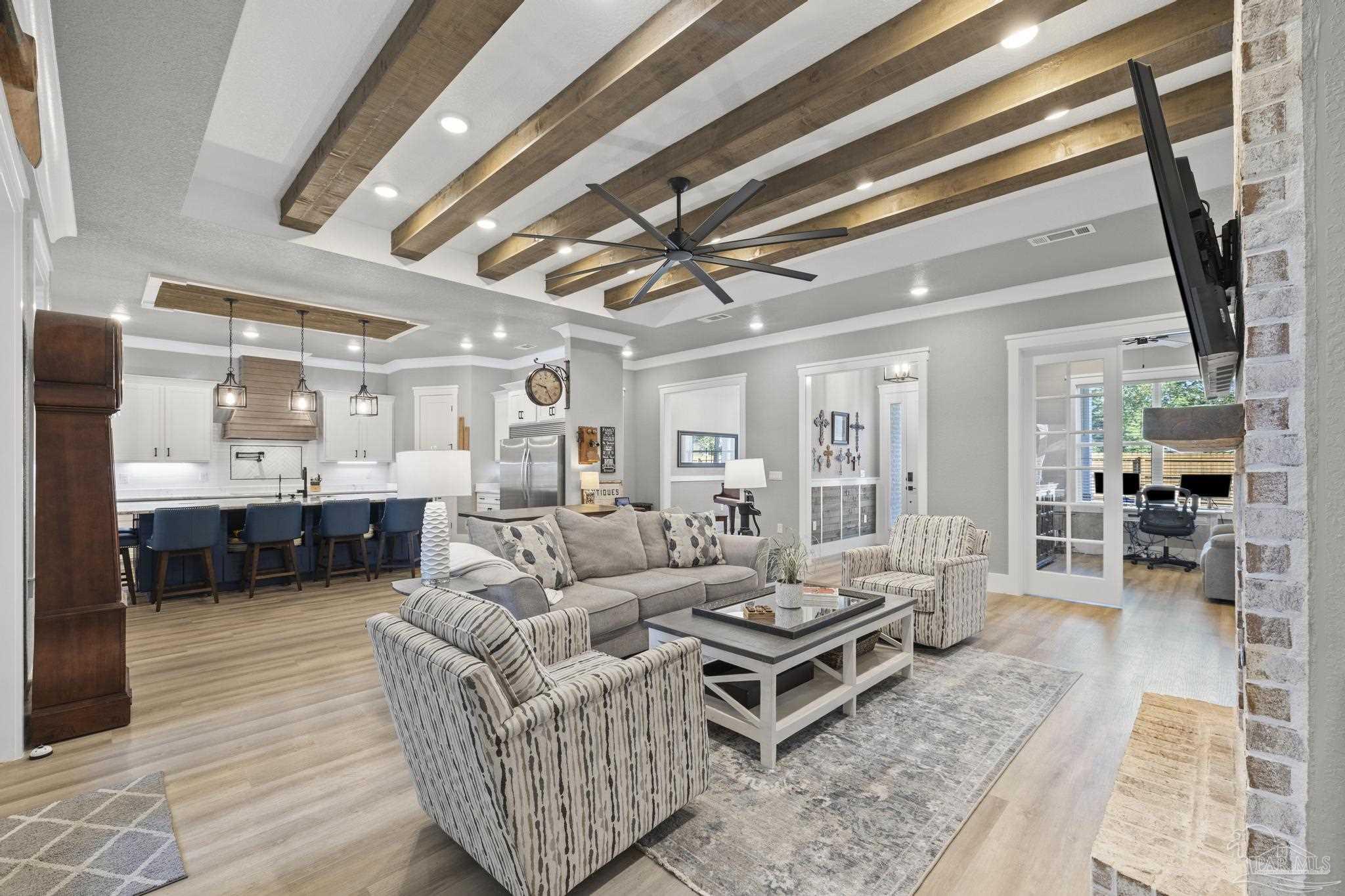 8415 Beulah Road Pensacola, FL 32526 - Photo 11 of 59 a living room with furniture a rug and kitchen view