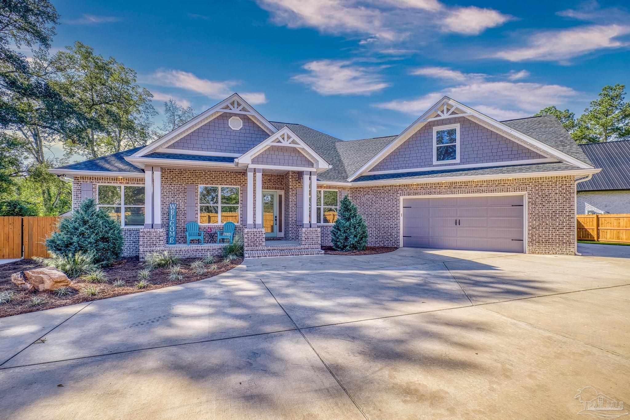 8415 Beulah Road Pensacola, FL 32526 - Photo 2 of 59 a front view of a house with yard and green space
