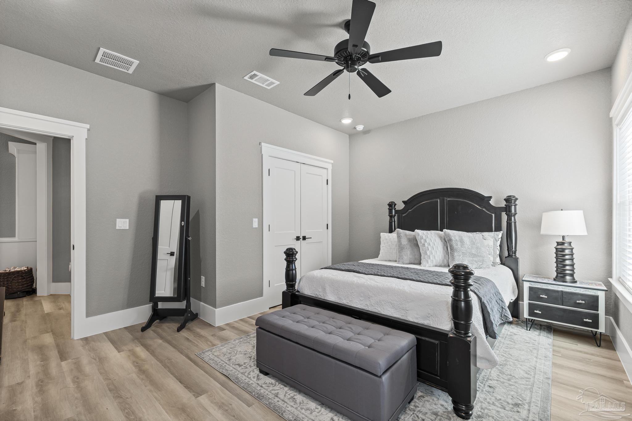 8415 Beulah Road Pensacola, FL 32526 - Photo 24 of 59 a bedroom with a bed and a ceiling fan