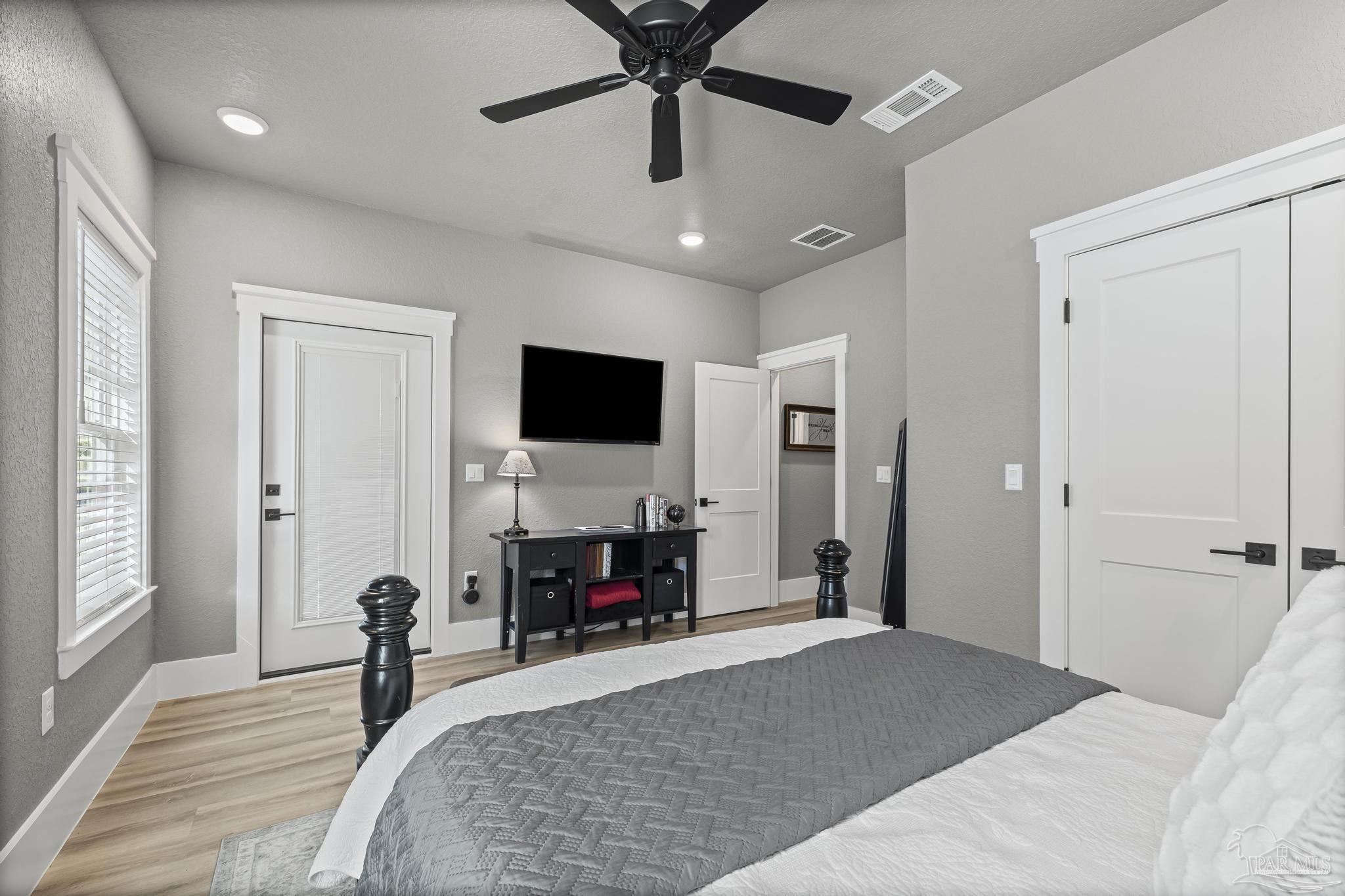 8415 Beulah Road Pensacola, FL 32526 - Photo 25 of 59 a bedroom with a bed and a flat screen tv