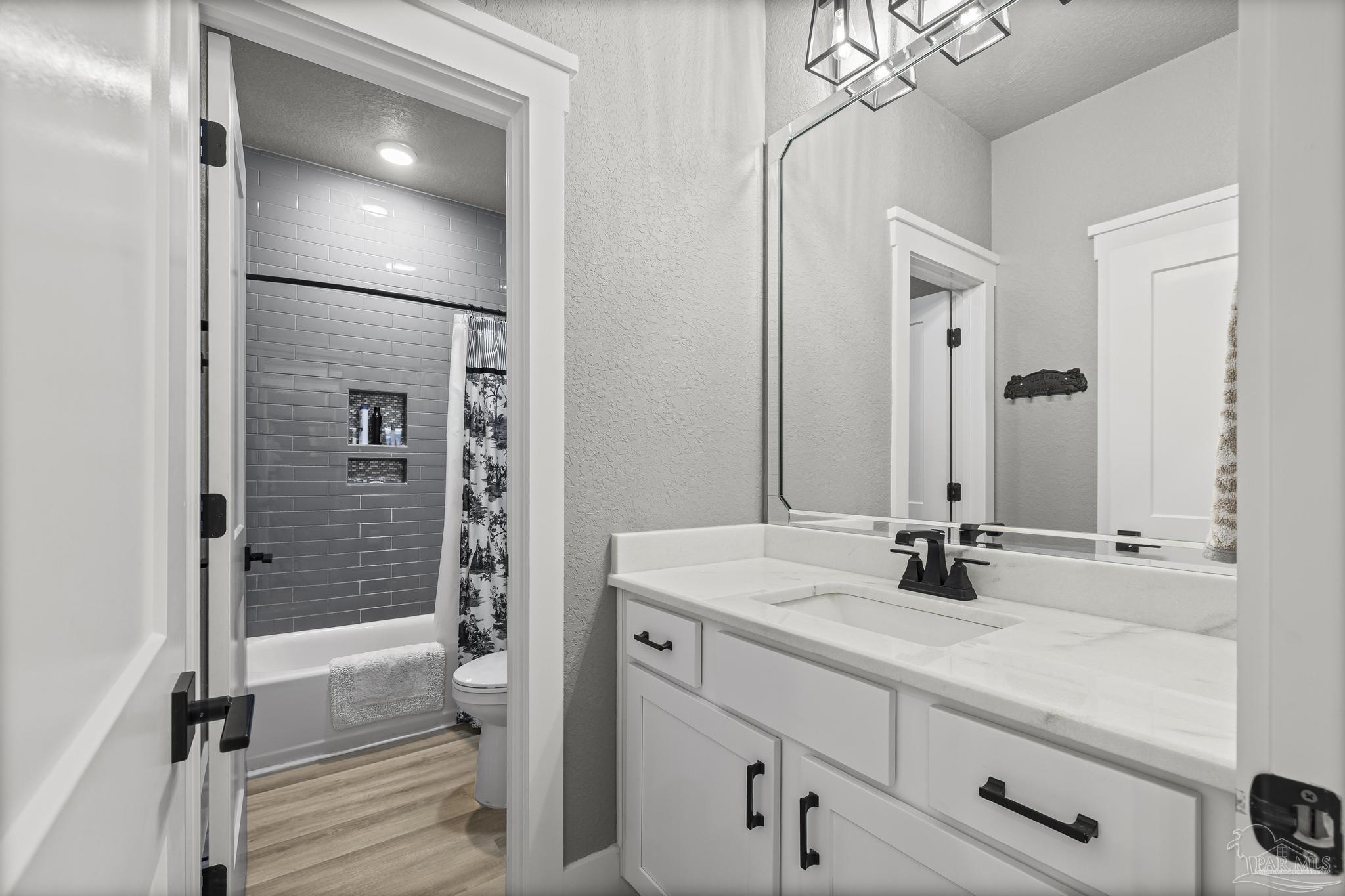 8415 Beulah Road Pensacola, FL 32526 - Photo 26 of 59 a bathroom with a sink a toilet and shower