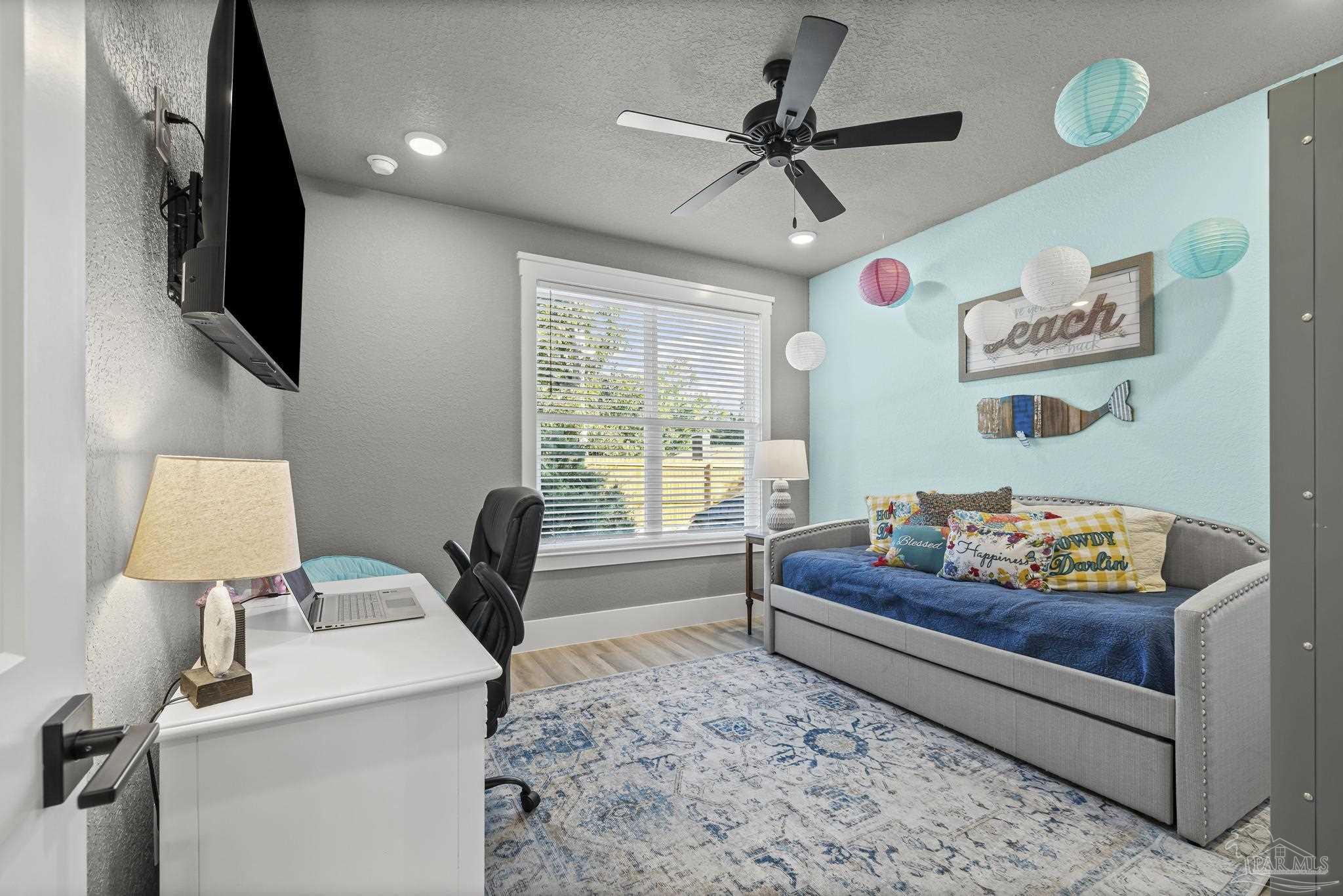 8415 Beulah Road Pensacola, FL 32526 - Photo 27 of 59 a living room with furniture and a flat screen tv