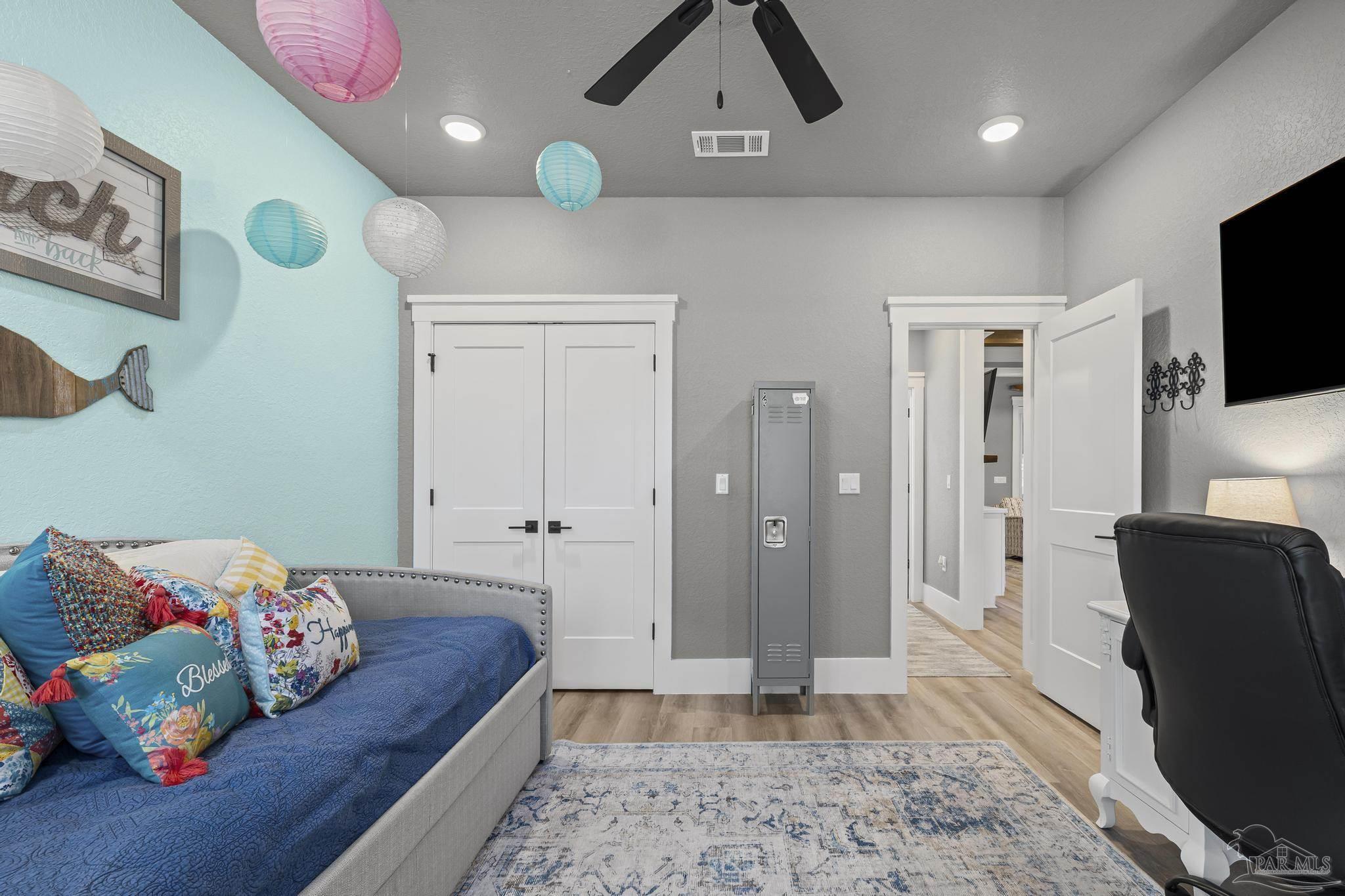 8415 Beulah Road Pensacola, FL 32526 - Photo 28 of 59 a living room with furniture and a flat screen tv