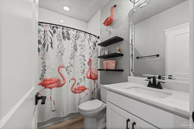 a bathroom with a sink and toilet