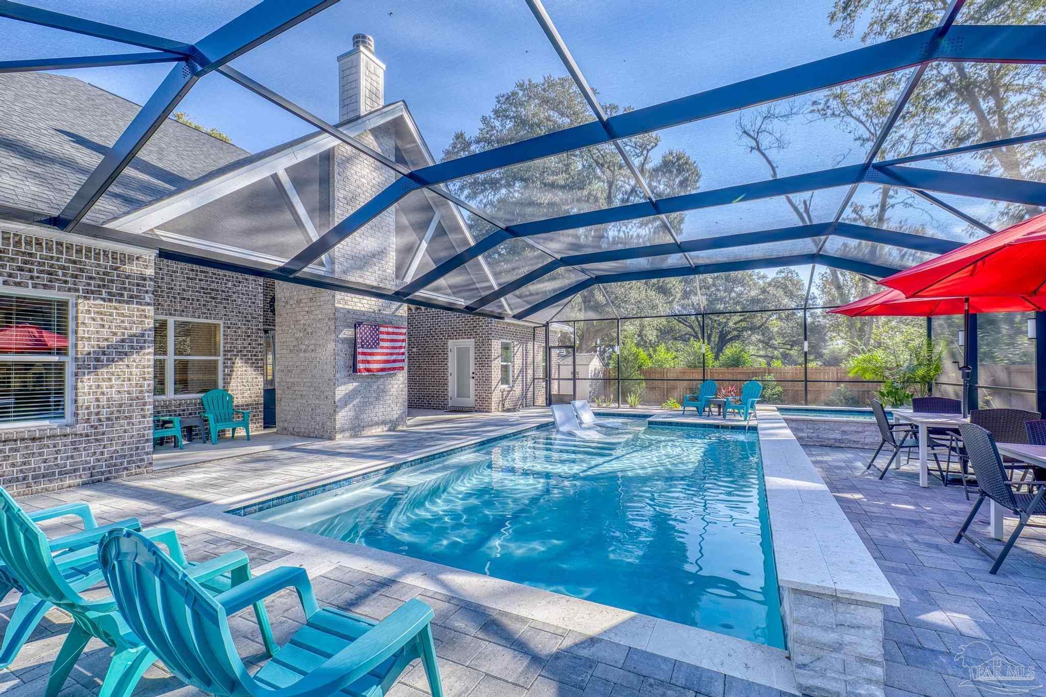 8415 Beulah Road Pensacola, FL 32526 - Photo 3 of 59 a patio with a table and chairs