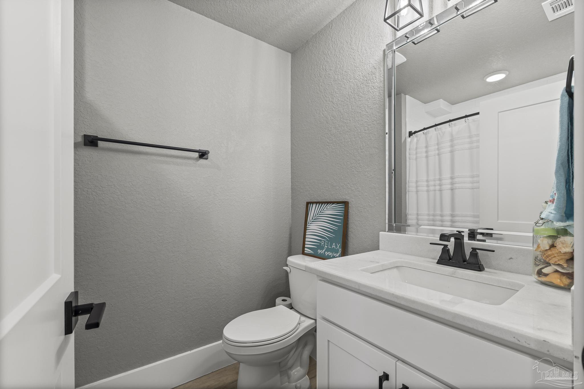 8415 Beulah Road Pensacola, FL 32526 - Photo 34 of 59 a bathroom with a sink a toilet and shower