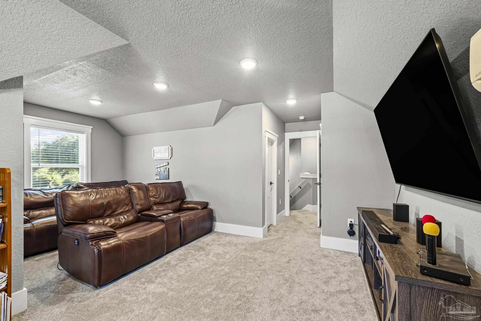 8415 Beulah Road Pensacola, FL 32526 - Photo 35 of 59 a living room with furniture and a flat screen tv