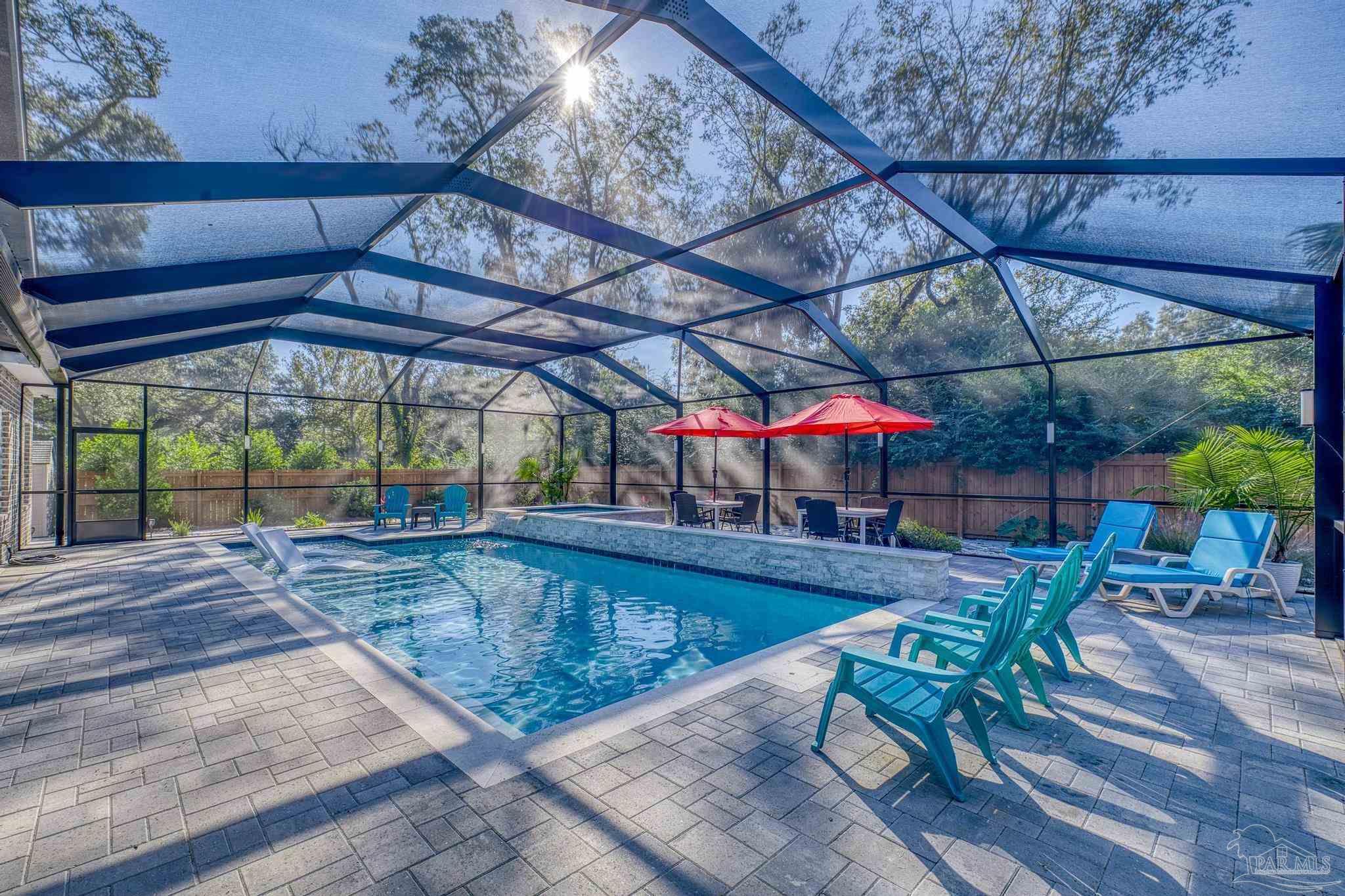 8415 Beulah Road Pensacola, FL 32526 - Photo 43 of 59 a view of a swimming pool with a patio