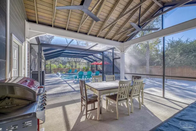 a view of a yard in front of a house with large trees