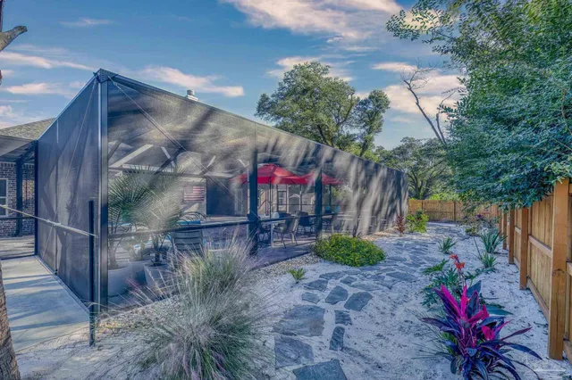 an aerial view of house with yard swimming pool and outdoor seating